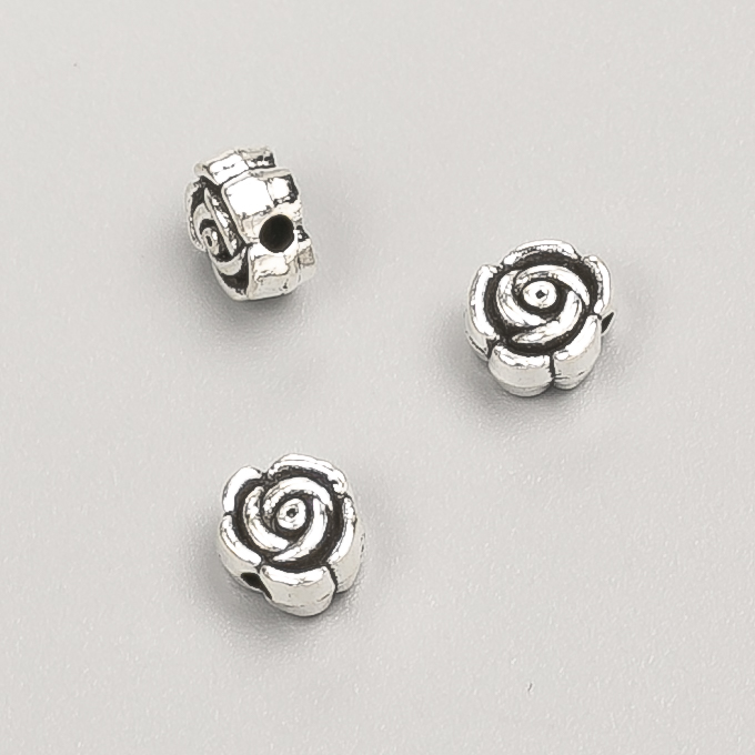 Фурнітура намистина вставка Квітка, діаметр 7х4мм фас. 20гр. 39шт+- колір металу "срібло"